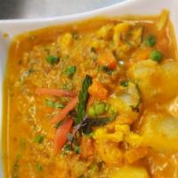 Korma · Flavored chicken, lamb or vegetables cooked in a sauce of green chilies, coconut, poppy seed...
