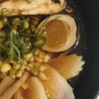 Shoyu Ramen · Soy pork bone broth wavy egg noodle topped with chashu pork shichimi powder chili and sesame...