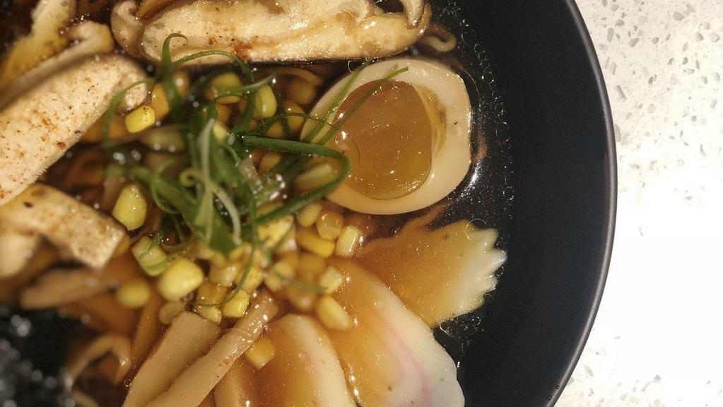 Shoyu Ramen · Soy pork bone broth, wavy egg noodles topped with chashu pork, shichimipower, chilli, and sesame oil, fishcake, bamboo shoot, scallion, and seasoned boiled egg.