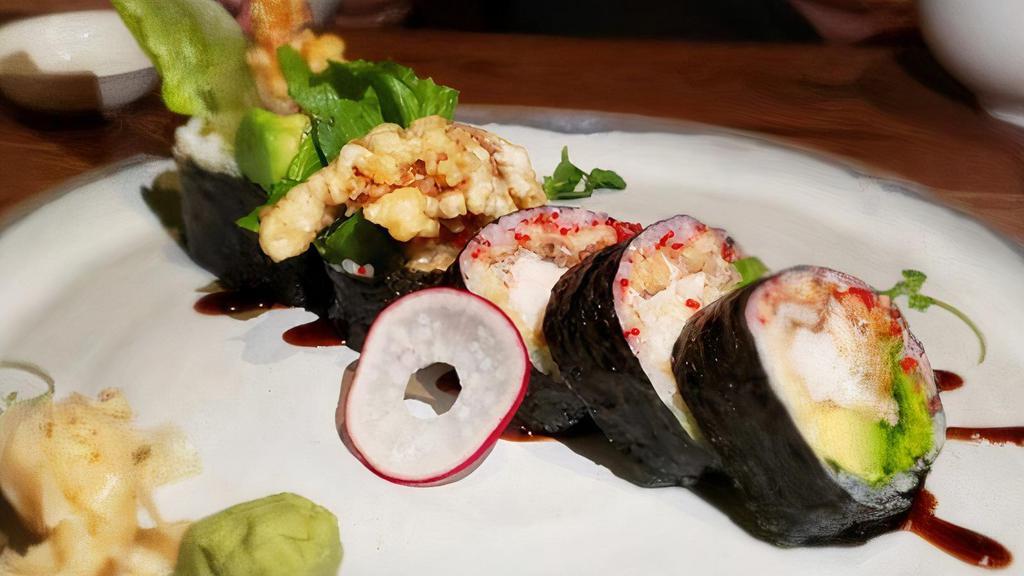Spider Roll · Deep fried soft shell crab, avocado. Topped with tobiko and eel sauce.