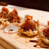 Crispy Spicy · Tempura rice with nori topped with spicy crunch tuna, tobiko, scallion, eel sauce, and spicy...