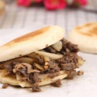 #1 Lamb Flatbread Sandwiches 羊肉夹馍 · Spicy. Cumin spices lamb with green onion within freshly backed chinese flatbread.