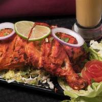 Kodi Tandoori · Chicken leg and thigh pieces are marinated overnight in yogurt with herbs, spices, and cooke...
