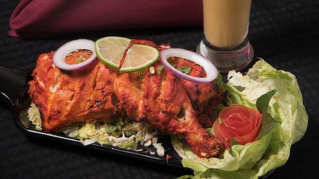 Kodi Tandoori · Chicken leg and thigh pieces are marinated overnight in yogurt with herbs, spices, and cooked on skewers in tandoor (clay oven).