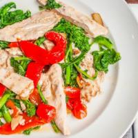 Grilled Chicken Paillard · Thinly sliced chicken breast marinated in fresh herbs, served with garlic and olive oil saut...