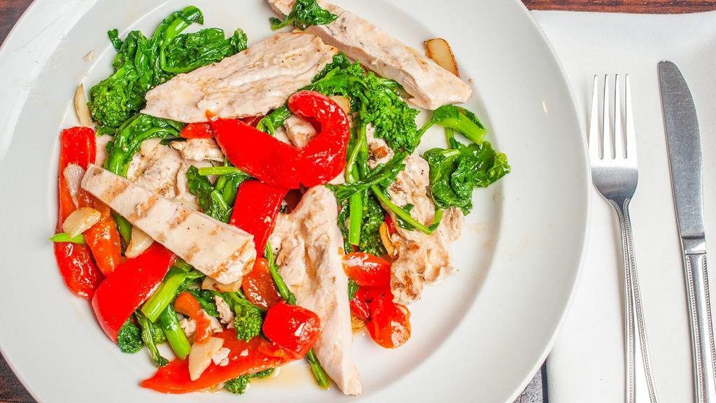 Grilled Chicken Paillard · Thinly sliced chicken breast marinated in fresh herbs, served with garlic and olive oil sauteed broccoli rabe and fire roasted red peppers.