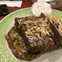 Cinnamon Almond French Toast · Home style challah bread French toast encrusted in cinnamon and almonds.
