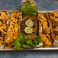 Bandeja Familiar / Family Platter · Pescado entero frito, ceviche de camarón, camarón apanado, chicharrón de pescado y calamar a...