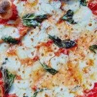 Margherita Pizza · mozzarella | parmesan | extra virgin olive oil | basil | sea salt