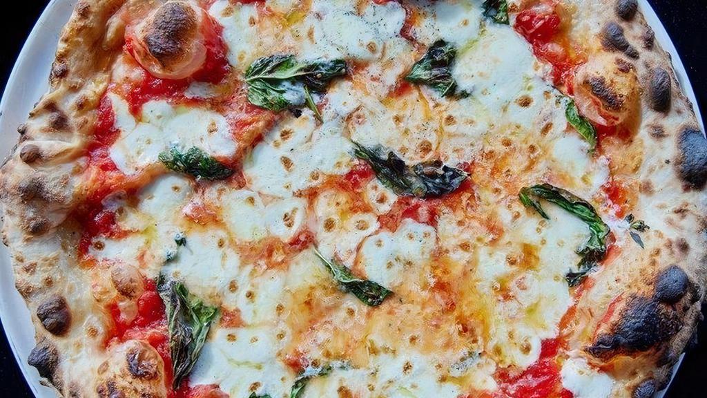 Margherita Pizza · mozzarella | parmesan | extra virgin olive oil | basil | sea salt