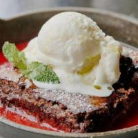 Chocolate Cake · Strawberry Coulis, warm chocolate cake, served with vanilla ice cream.