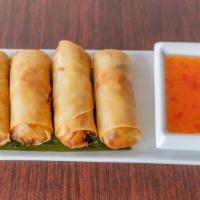 Hand Rolled Spring Roll (4 Pieces) · Deep-fried crispy veggie spring rolls served with sweet chili sauce.