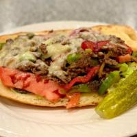 Steak & Cheese · Provolone cheese, lettuce, tomato, onion, red and green pepper, and mayo on sub.