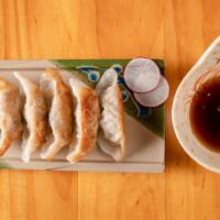 Gyoza · Pan fried pork dumplings.