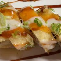  Eagles Roll · Spicy crab meat, avocado, cream cheese inside, tempura style with special sauce on top.