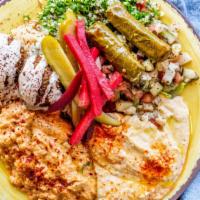 Vegan Combo Plate · Falafel, vegetarian grape leaves, tabbouleh, fattoush, hummus, baba ghannouj, pilaf, pickles.