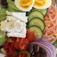 Greek Salad · House salad, feta cheese, eggs and kalamata olives.