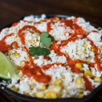 Corn 'Elote Locos' · Crema mexicana, charred sweet corn, cotija cheese, red chili and lime.