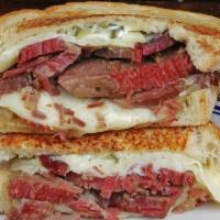 East Side Brisket · Salted brisket, Swiss cheese, garlic aioli, spicy brown mustard, caramelized onions and pick...