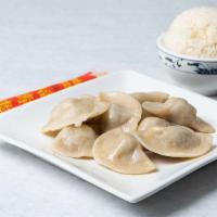 Pork And Chive Dumplings (10 Pcs.) · Most popular. 10 pieces.  Steamed dumplings shown in picture.
