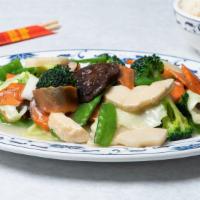 Sautéed Assorted Vegetables · Includes sauce on the side and steamed rice.