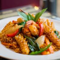 Phuket Fried Rice · Stir-fried spicy rice with shrimp, scallops, squid, mussels, onions, red pepper, and basil.