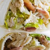 Chicken Caesar Wrap · Oven roasted seasoned chicken breast with aged shredded Parmesan cheese, crisp romaine lettu...