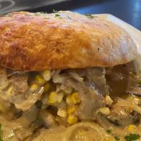 Pot Roast Pie · Mashed potatoes topped with pot roast, onions, mushrooms, corn , carrot  smothered in Guinne...