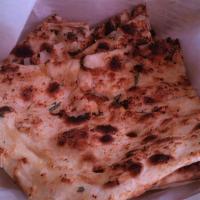 Garlic Naan · Leavened bread with garlic, cilantro and spices.