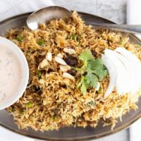 Lamb Biryani · Lamb cooked in basmati rice flavored with curry sauce with fruits and nuts.