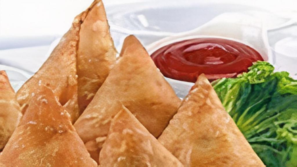 Delicious Sambusa · Sambusa is a deep fried triangular shaped pastry filled with beef meat and spices only our restaurant.