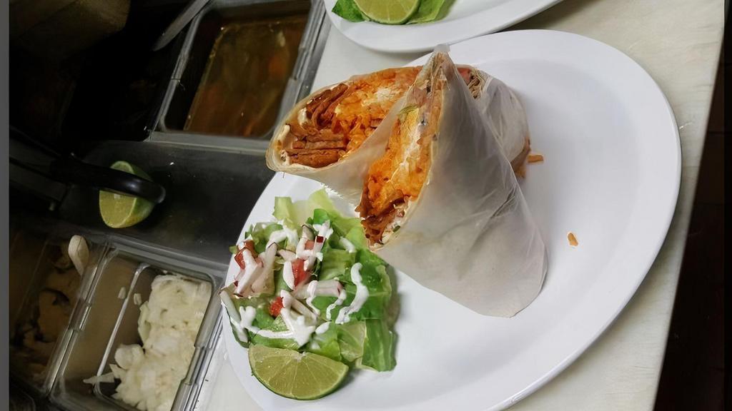Veggie Burritos · Served with choice of tortilla, green peppers, onions, avocado and tomatoes, cheese, sour cream, pico de gallo, rice and beans.