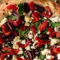 Greek Pizza · Fresh tomatoes olives, feta cheese, onion, and green peppers.