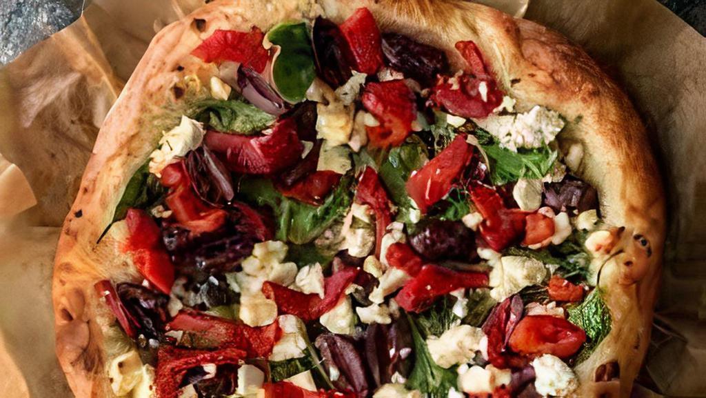 Greek Pizza · Fresh tomatoes olives, feta cheese, onion, and green peppers.