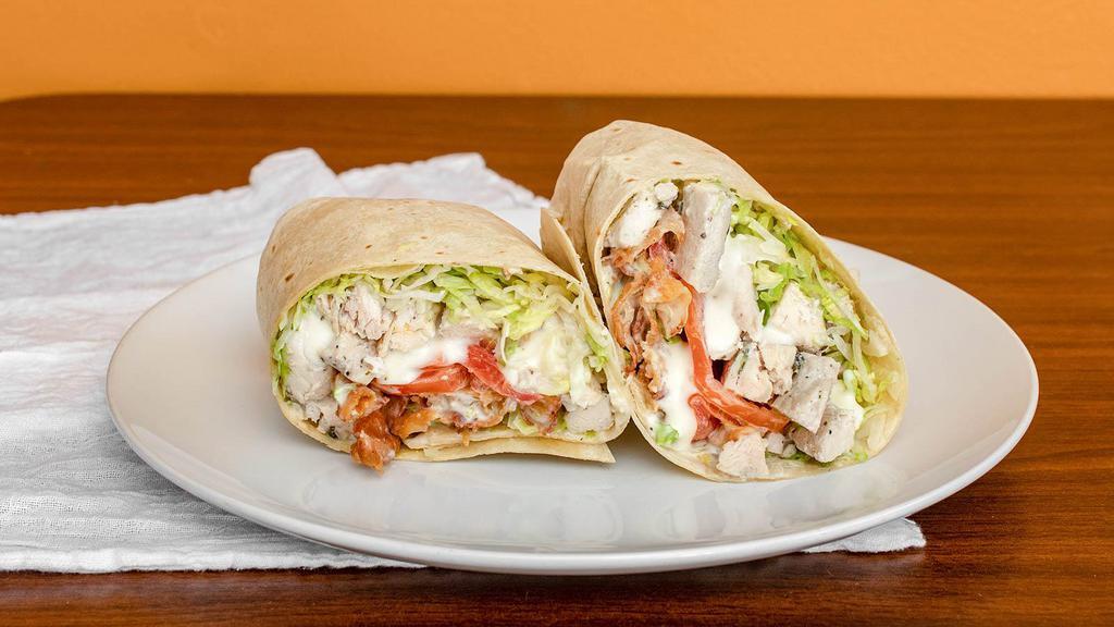 Chicken Ranch Wrap · Grilled chicken, romaine lettuce, cucumbers, onion, crispy bacon and ranch dressing.