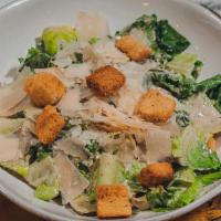 Caesar Salad · Romaine lettuce with caesar dressing croutons and parmesan.