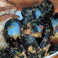 Sicillian Mussels · roasted tomatoes and garbanzo bean pesto,  calabrian chile, grilled bread