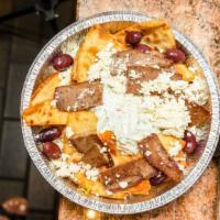 Pita Chips Platter · Pita bread wedges topped with gyro meat, tzatziki, feta cheese and olives.