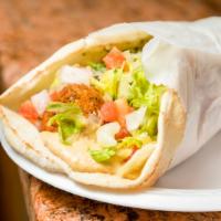 Falafel Wrap · Fried chickpeas with tahini sauce. Served in Greek pita bread with lettuce, tomatoes and oni...