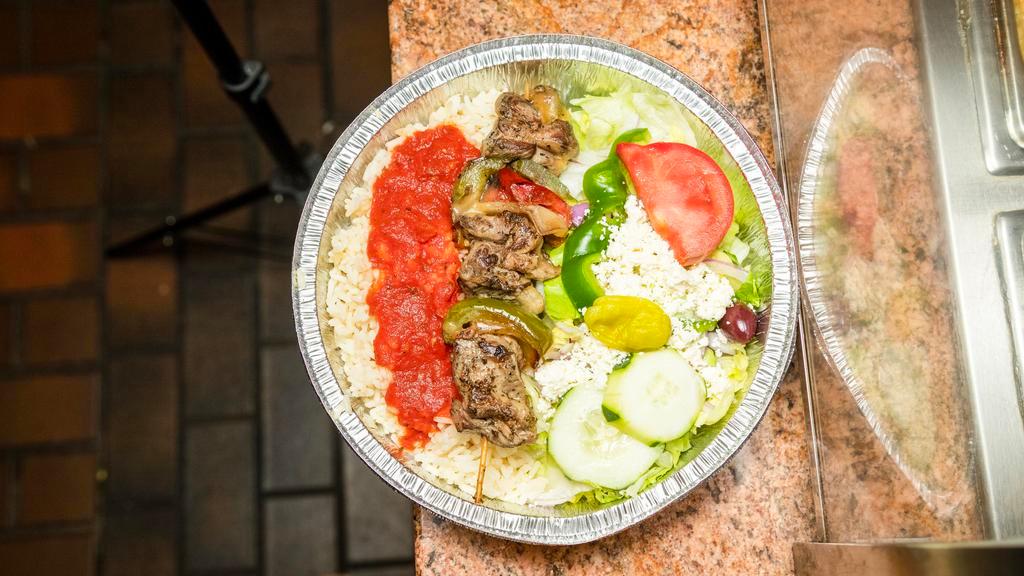 Lamb Kebab Dinner · Grilled lamb on a stick with peppers, onions & tomatoes. Served with Greek salad and your choice of rice pilaf or French fries.