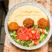 Falafel Plate · Hummus, tabbouleh and falafel cubes topped with tahini sauce.