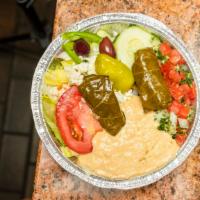 Steve'S Sampler Plate · Greek salad, hummus, tabbouleh and veggie grape leaves.