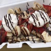 Nutella Crepe · Two crepes filled with Nutella, topped with fresh strawberries, banana slices, whipped cream...