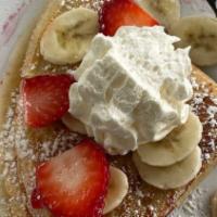Strawberry-Banana Crepe · Two crepes filled with homemade strawberry cream, topped with fresh strawberries, banana sli...
