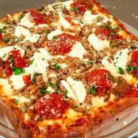 Lasagna Pizza · Meatballs, sausage, ricotta, tomato sauce and mozzarella