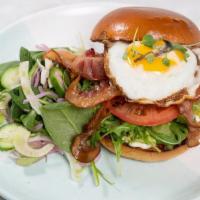 L.A.T.E. · Crispy bacon, avocado, arugula, tomato, a fried egg & garlic aioli on a brioche roll served ...