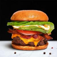 Legacy Of Bacon & Egg Burger · American beef patty topped with bacon, fried egg, avocado, melted cheese, lettuce, tomato, o...