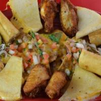 Fiesta Platter · Taquitos, flautas, quesadillas, nachos, beans, chicken wings, guacamole, sour cream, and pic...