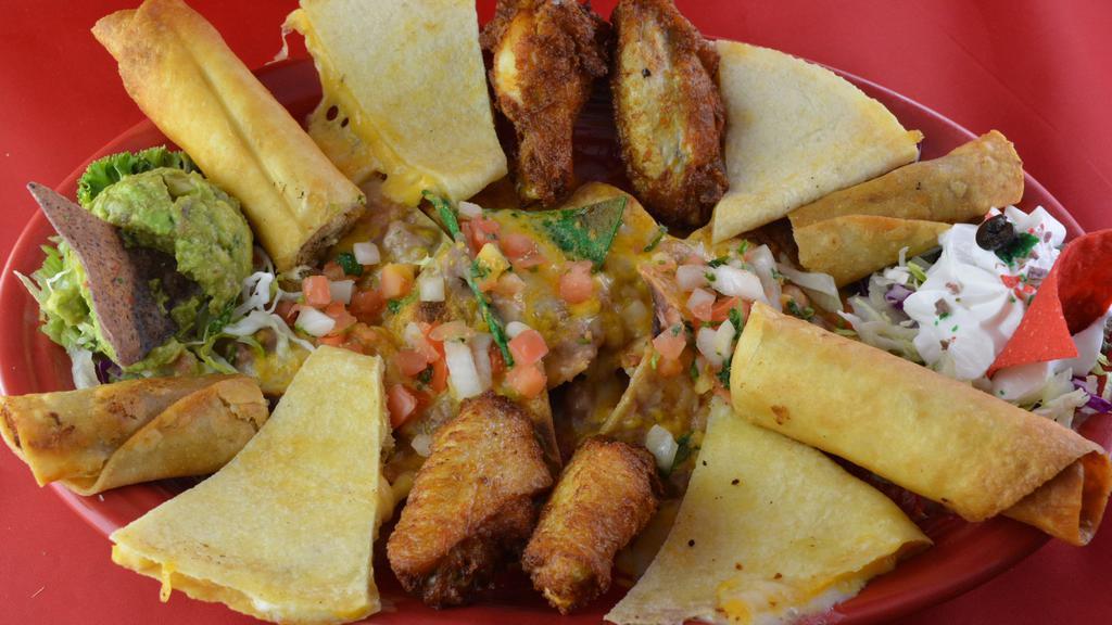 Fiesta Platter · Taquitos, flautas, quesadillas, nachos, beans, chicken wings, guacamole, sour cream, and pico de gallo.