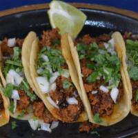 Mini Chorizo · Five little corn tortillas filled with Mexican sausage, grilled onions, raw onions, cilantro...